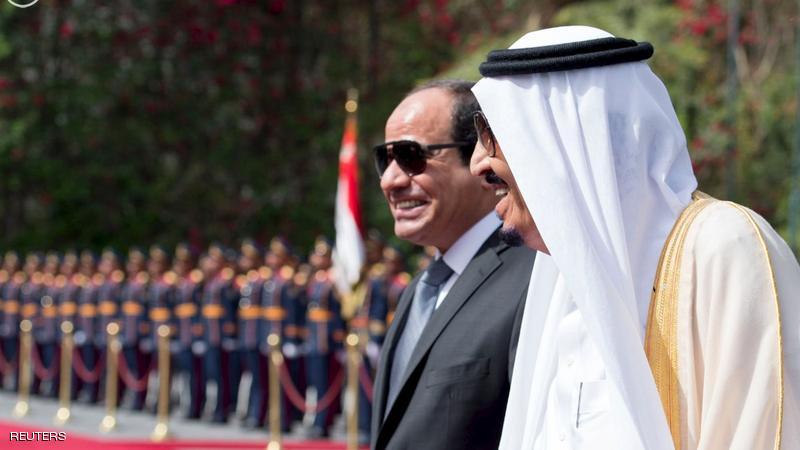 Egypt's President Abdel Fattah al-Sisi and Saudi Arabia's King Salman review the honour guards in Cairo
